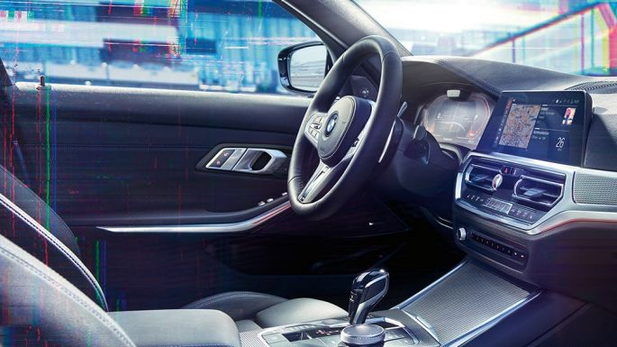 BMW 3 Series Sedan, M instrument cluster. Close-up of the interior of the BMW 3 Series Sedan with a lateral view of the cockpit and an instrument panel combination with M-specific display.