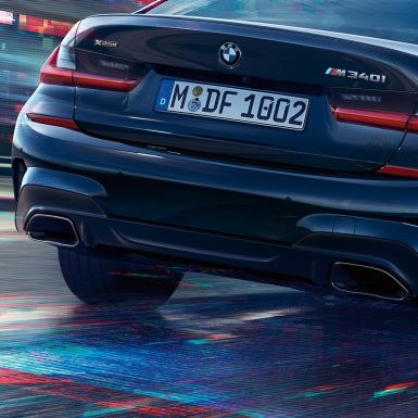 BMW 3 Series Sedan, M tailpipes. Close-up of the rear of the BMW 3 Series Sedan with M specific tailpipes in Cerium grey metallic.