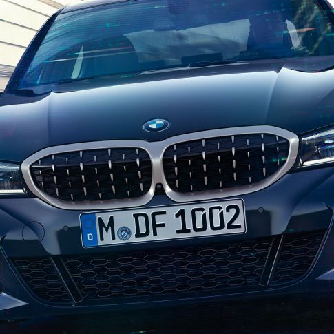 BMW 3 Series Sedan, BMW double kidney grille. Frontal close-up of the BMW double kidney grille with mesh design of the BMW 3 Series Sedan M340i xDrive.