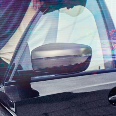BMW 3 Series Sedan, mirror caps. Detail view of the open driver's door with mirror caps in Cerium grey metallic.