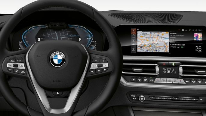 BMW 3 Series Sedan, 330e Cockpit. Detailed frontal view of the BMW 3 Series Sedan cockpit with i-specific display.