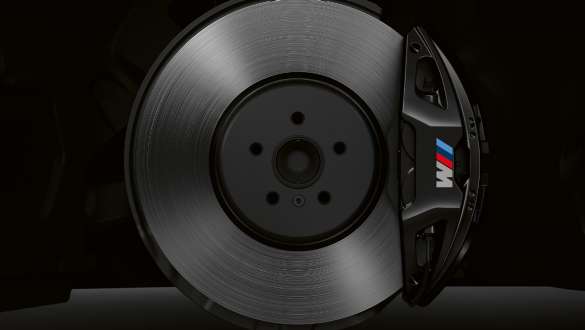 M Sport brake. BMW 8 Series Coupé, side shot on brake disk, blue-coloured M Sport brake.