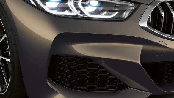Air inlets of the M Aerdodynamics package. BMW M850i xDrive Convertible in Dravit Grey metallic with M Aerdodynamics package, air inlets.