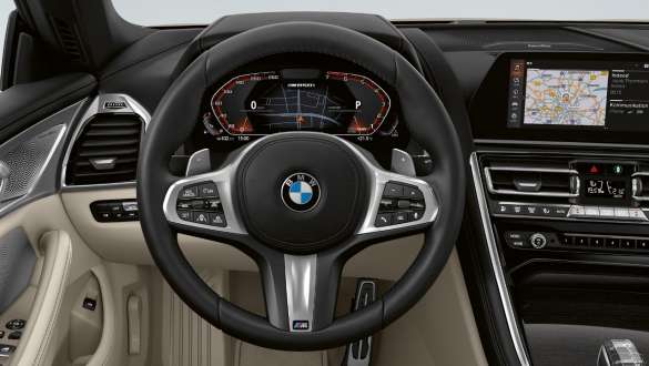 M leather steering wheel. Cockpit of the BMW M850i xDrive Convertible with M leather steering wheel.