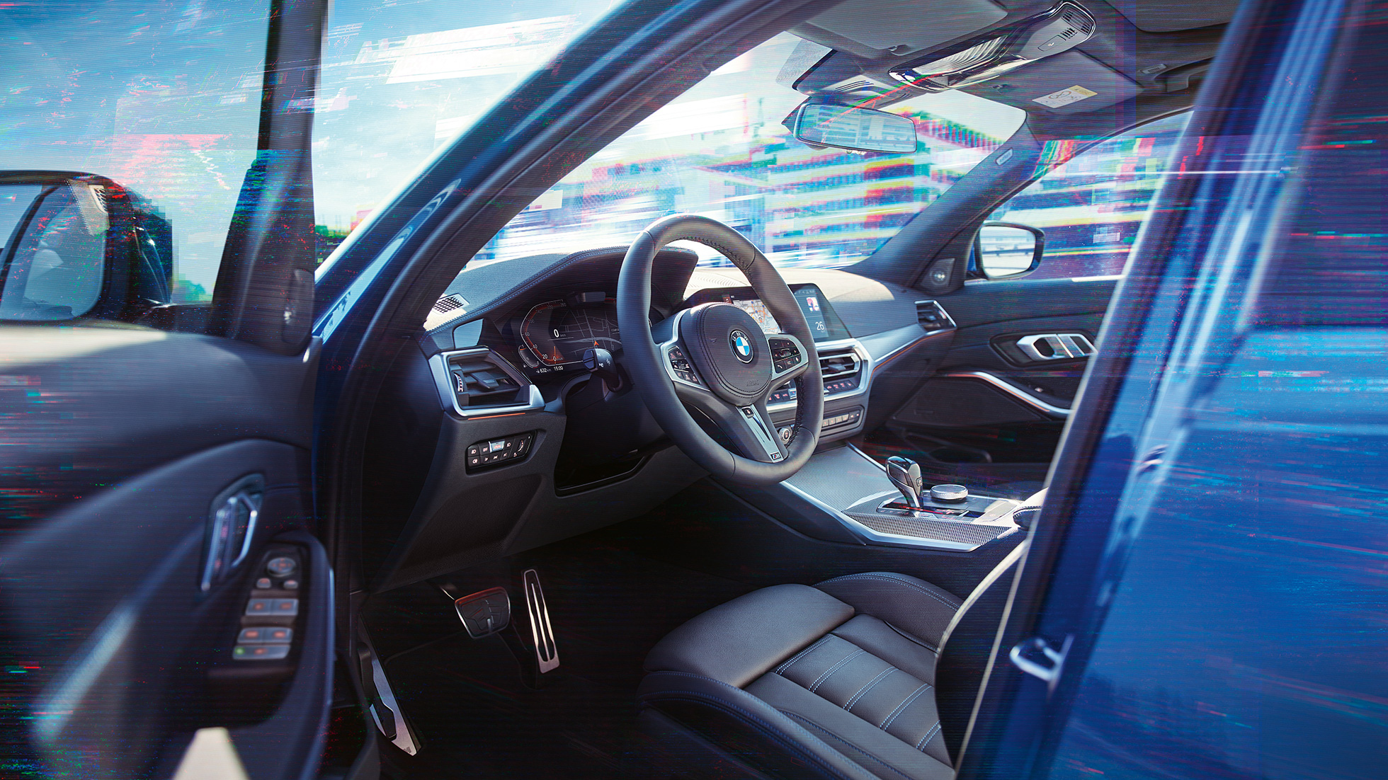 BMW 3 Series Sedan, interior. Close-up of the driver's compartment in the interior of the BMW 3 Series Sedan.