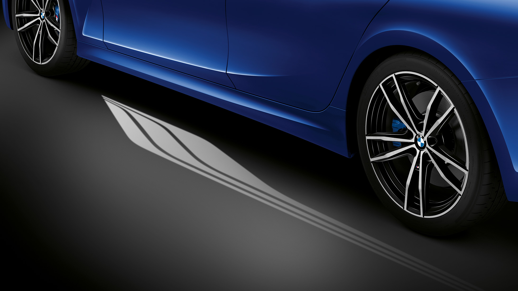 BMW 3 Series Sedan, Welcome Light Carpet. Detailed side view of the open driver's door with Welcome Light Carpet.