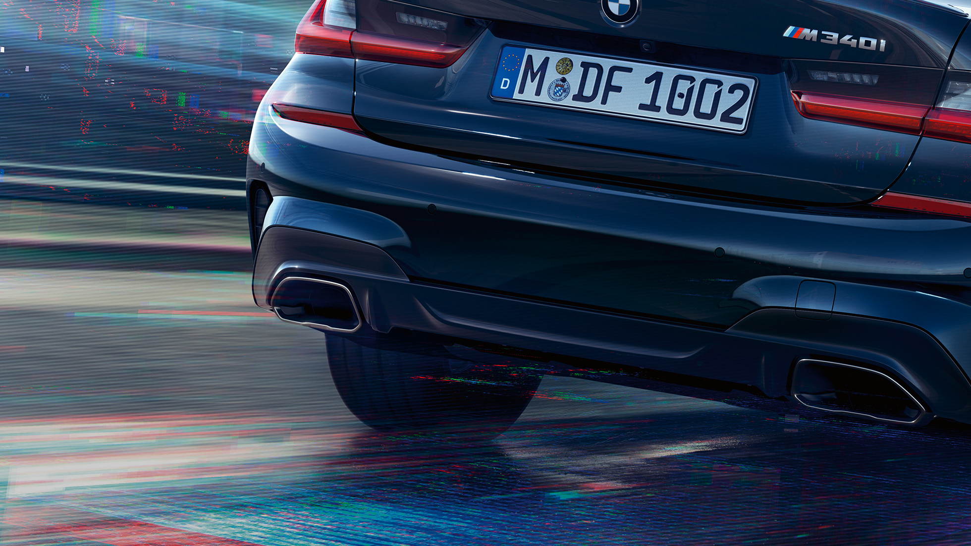 BMW 3 Series Sedan, M tailpipes. Close-up of the rear of the BMW 3 Series Sedan with M specific tailpipes in Cerium grey metallic.