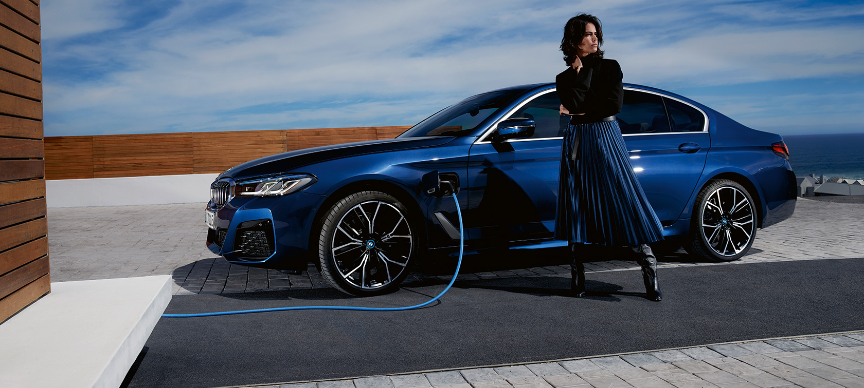 BMW 5 Series Sedan Plug-in hybrid 2021 G30 side view charging BMW 5 Series Sedan Plug-in hybrid 2021 G30 side view charging with model