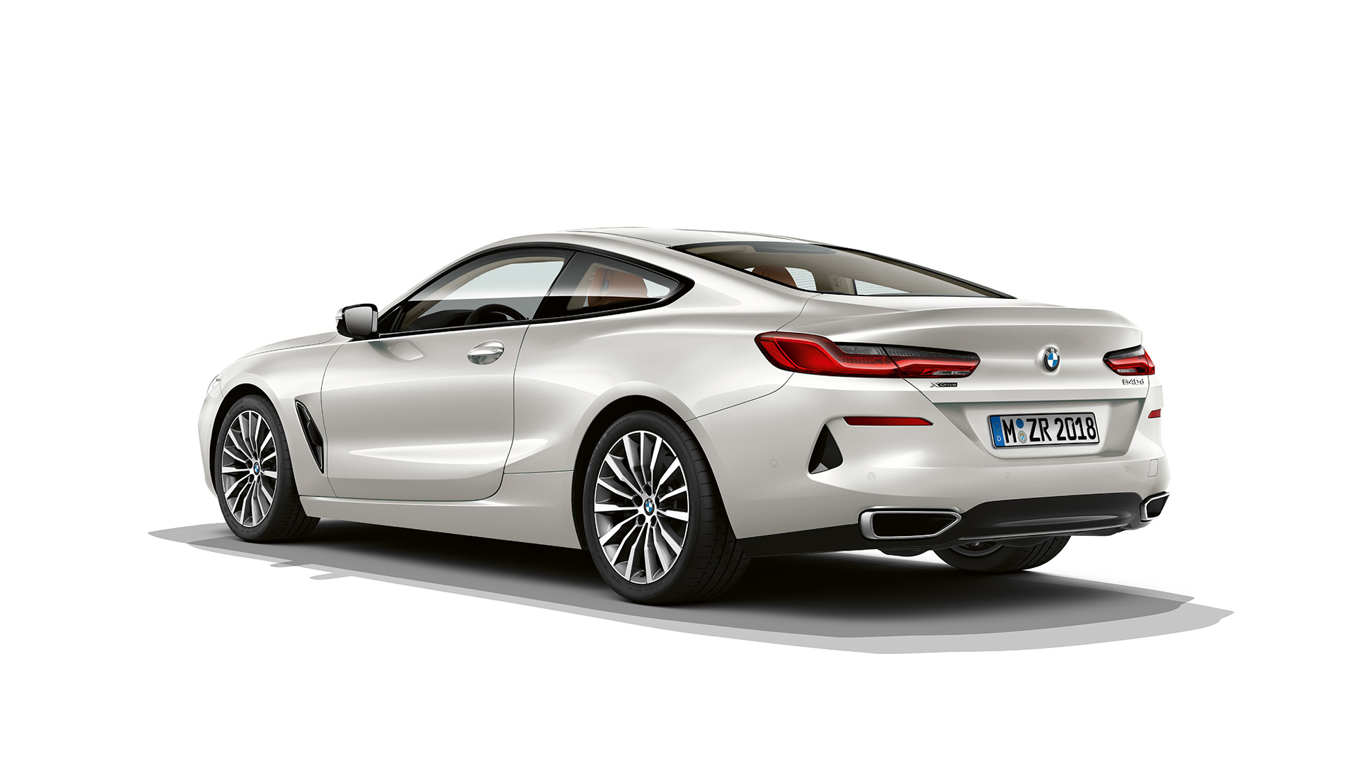 BMW 8 Series Coupé, three-quarter back view. BMW 8 Series Coupé, Mineral White metallic, three-quarter back view.