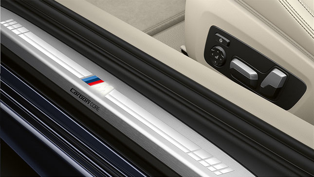 BMW 8 Series Coupé, door sill with M logo. Close-up of the door sill of the BMW 8 Series Coupé with M logo.