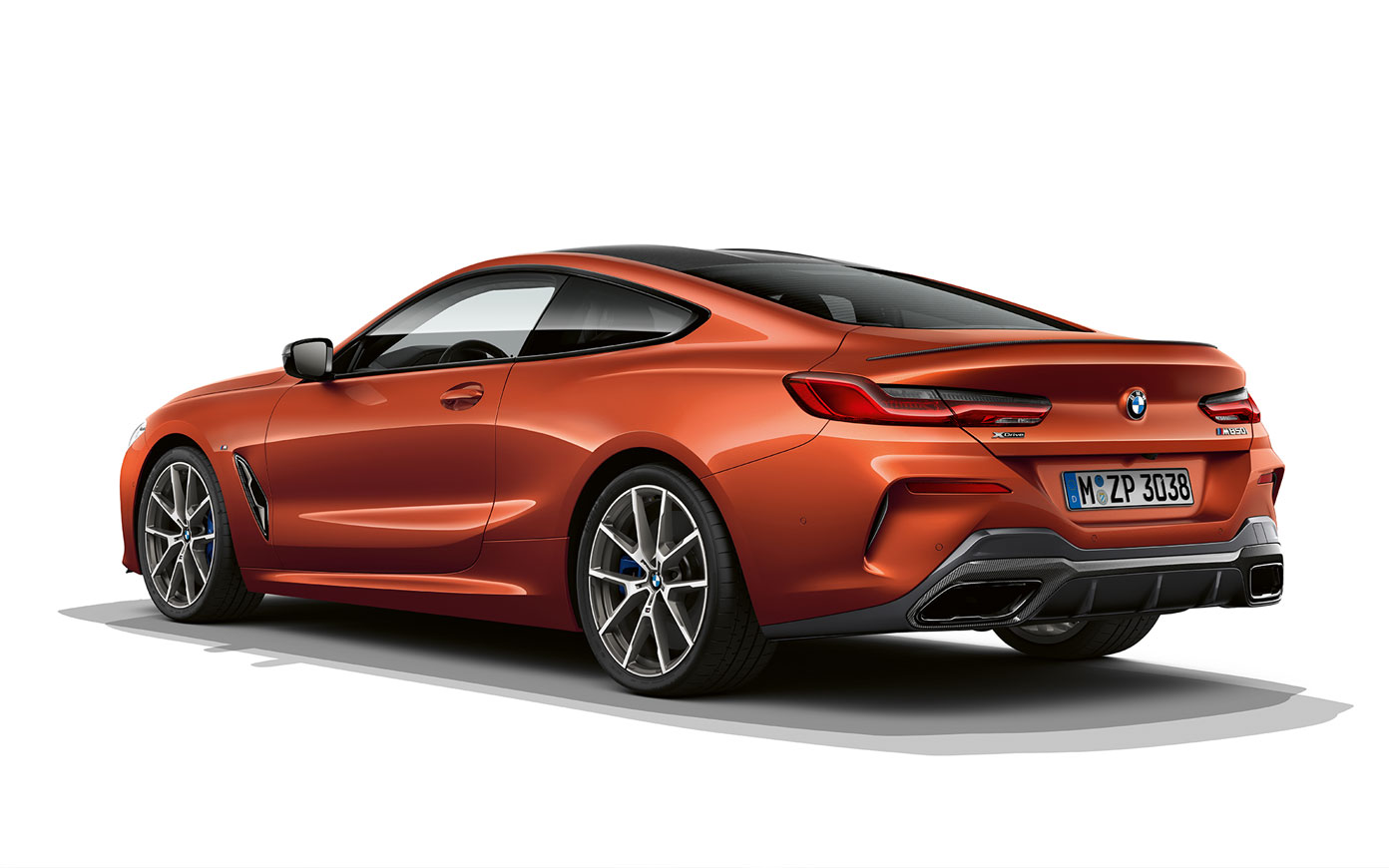 BMW 8 Series Coupé, Sunset Orange metallic. A still shot of the BMW 8 Series Coupé in Sunset Orange metallic against a white background.