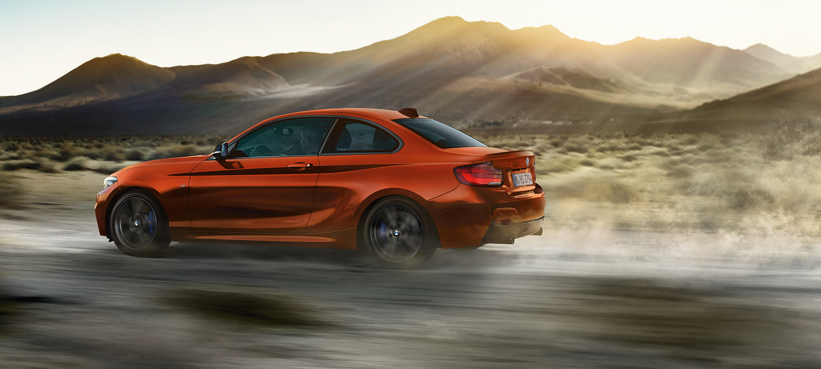 Driving dynamics BMW M240i Coupé Driving dynamics BMW M240i Coupé F22 2017 Sunset Orange metallic side view