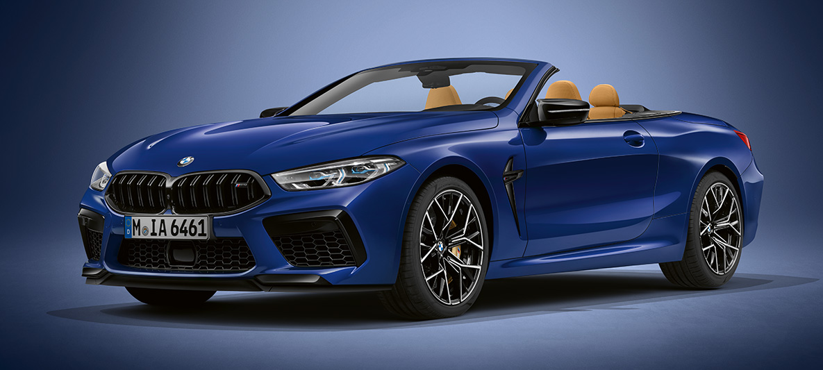 BMW Individual M8 Convertible in BMW Individual Tanzanite Blue metallic metallic. BMW Individual M8 Convertible in BMW Individual Tanzanite Blue metallic, three-quarter front view.