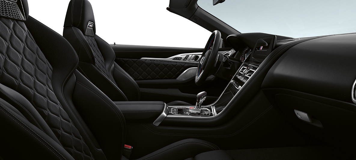 Full fine-grain leather 'Merino' | Black and BMW Individual interior trim Piano Finish Black. BMW M8 Competition Convertible, interior in full fine-grain leather 'Merino' | Black and BMW Individual interior trim Piano Finish Black.