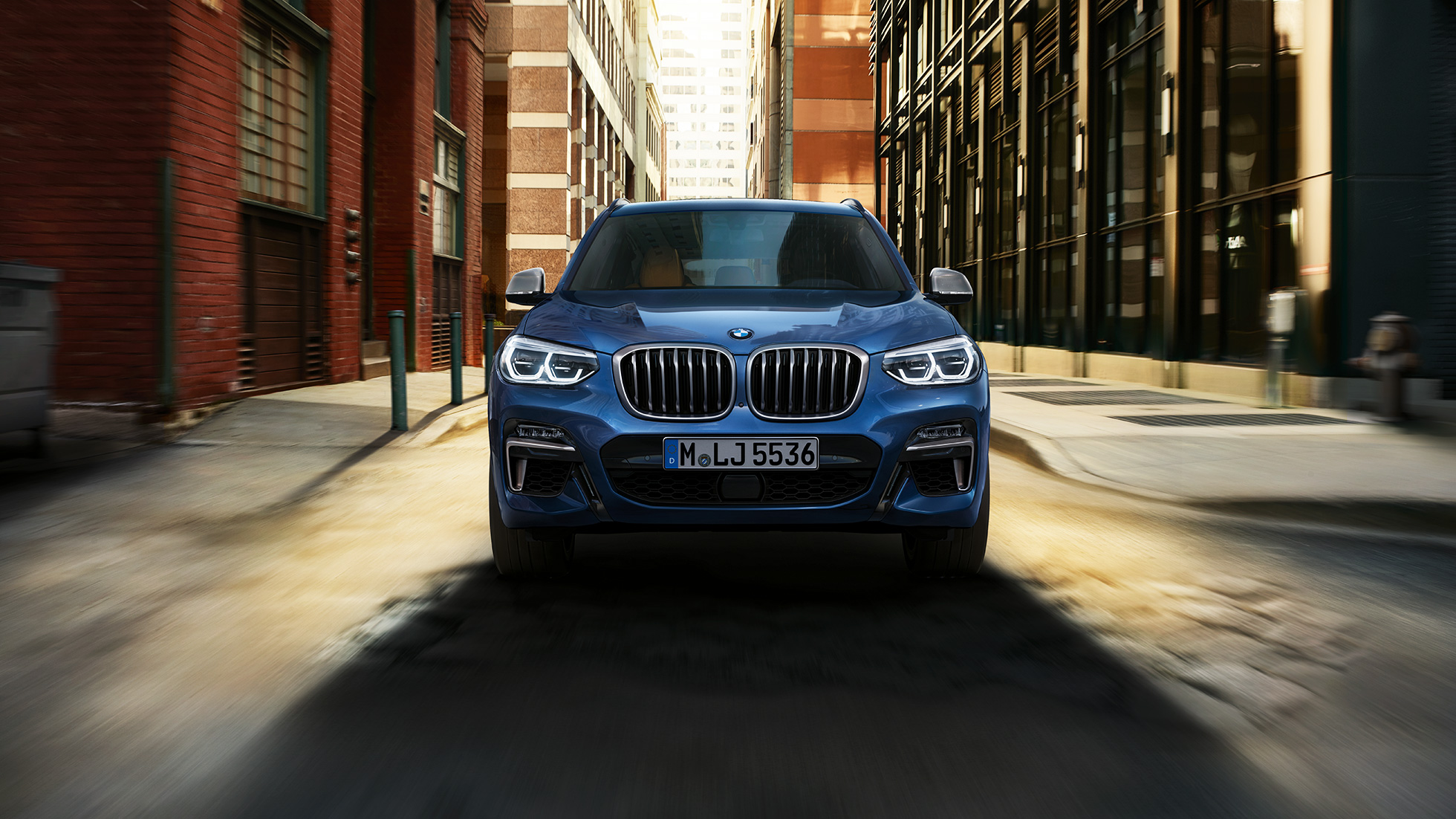 BMW X3 M40i, front shot in front of city scenery BMW X3 M40i, front shot in front of city scenery