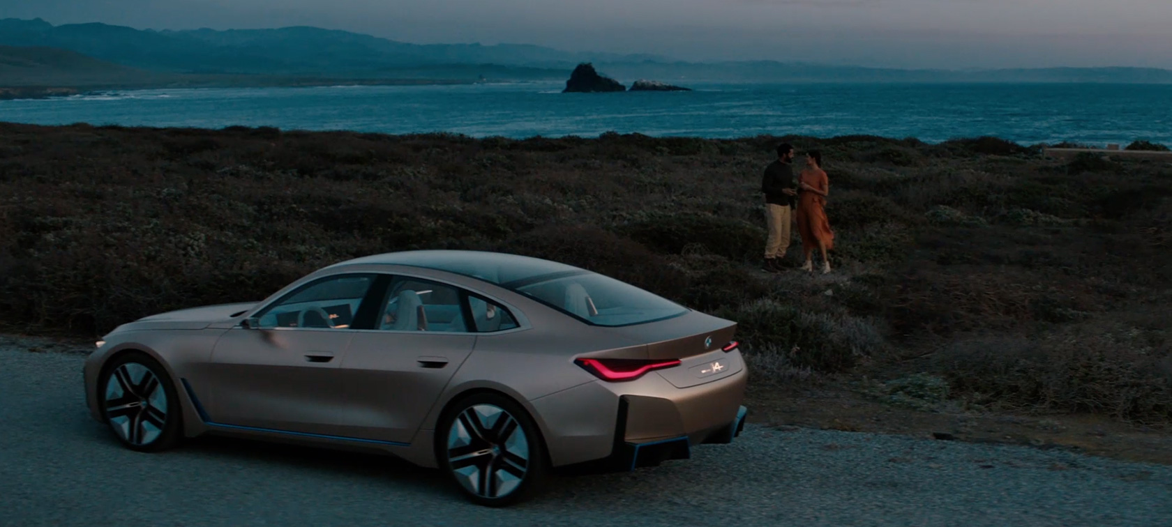 BMW Concept i4 2020 G26 Electric car fully electric BMW Gran Coupé three-quarter rear view at twilight on the coast