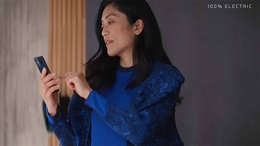 Connected Home Charging woman with smartphone video